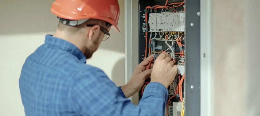 How Long Does It Take to Replace a Fusebox Technician working at an electrical distribution panel